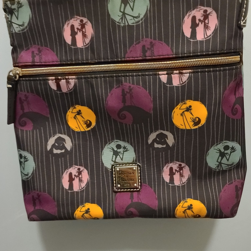 Used Dooney & Bourke NBC Crossbody purse.